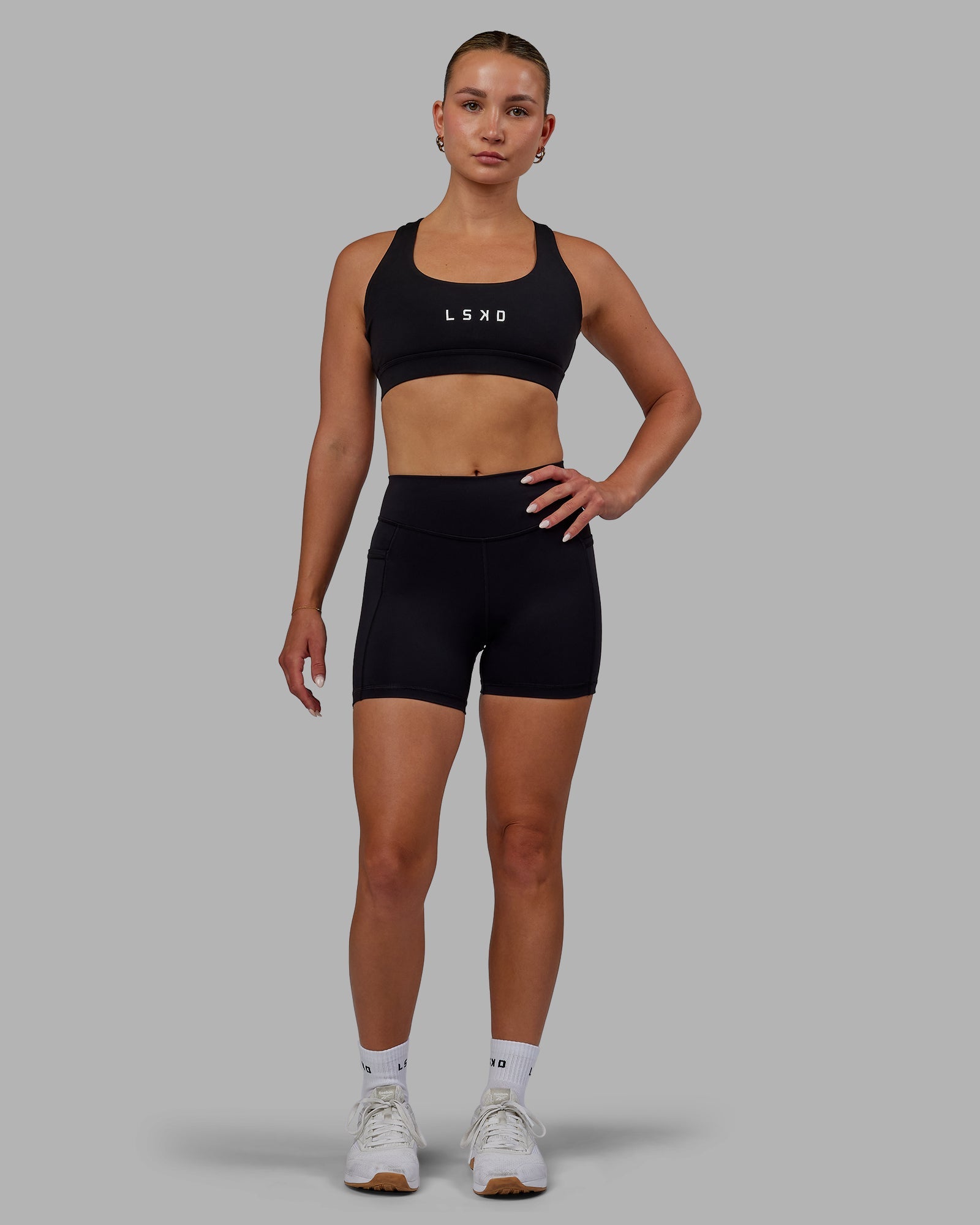 Woman wearing Elite High-Rise 4" Short Pockets - Black
