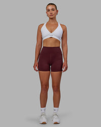 Woman wearing Elite High-Rise 4" Short Pockets - Dark Cherry
