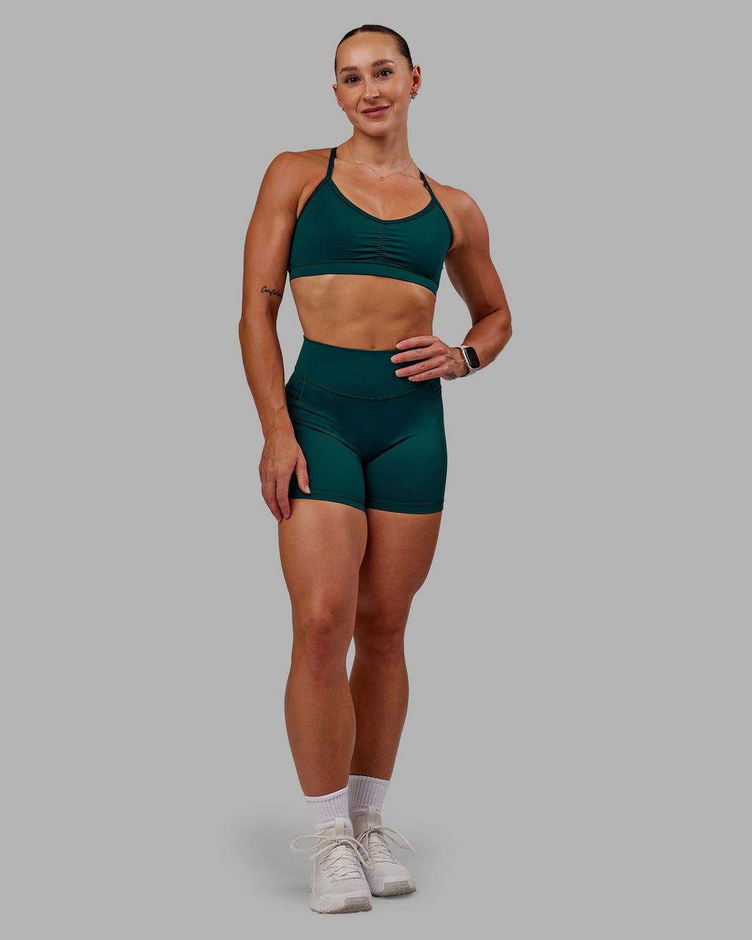 Woman wearing Elite X-Short Legging in Dark Moss| Size:S