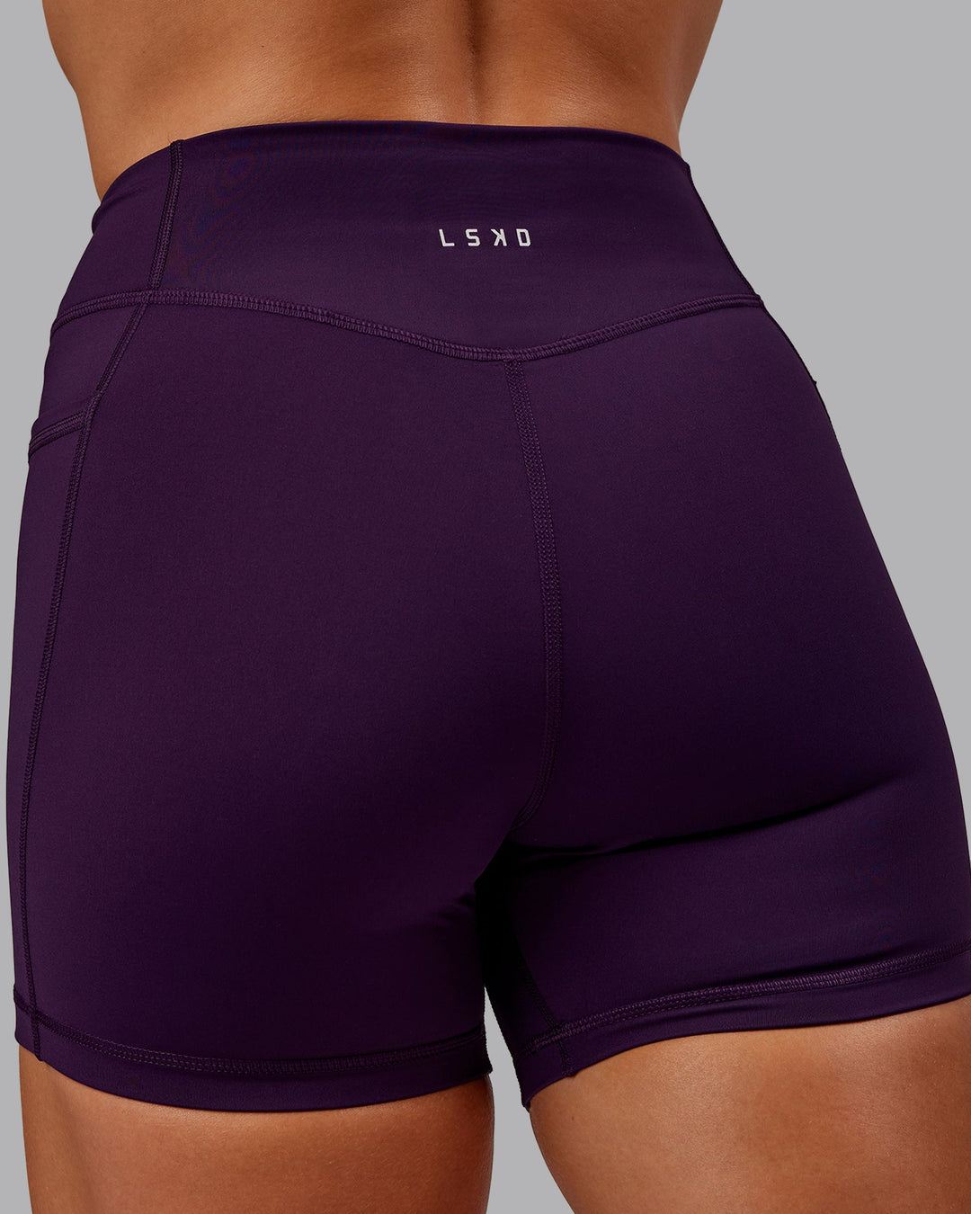 Woman wearing Elite X-Short Legging in Deep Purple | Size:S