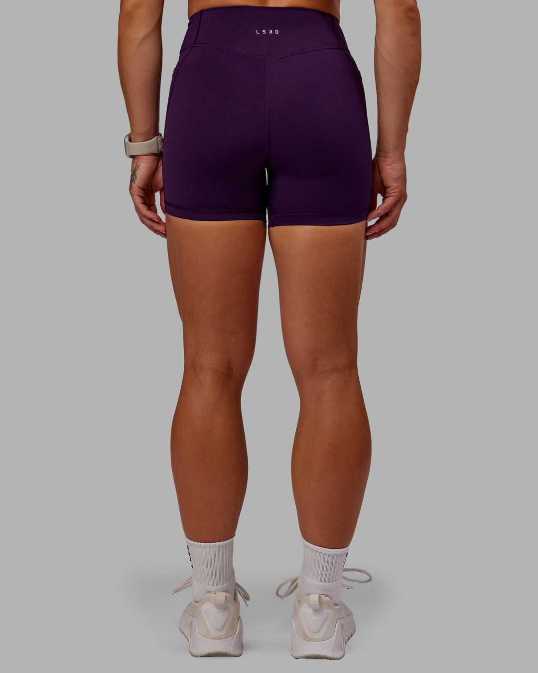 Woman wearing Elite X-Short Legging in Deep Purple | Size:S