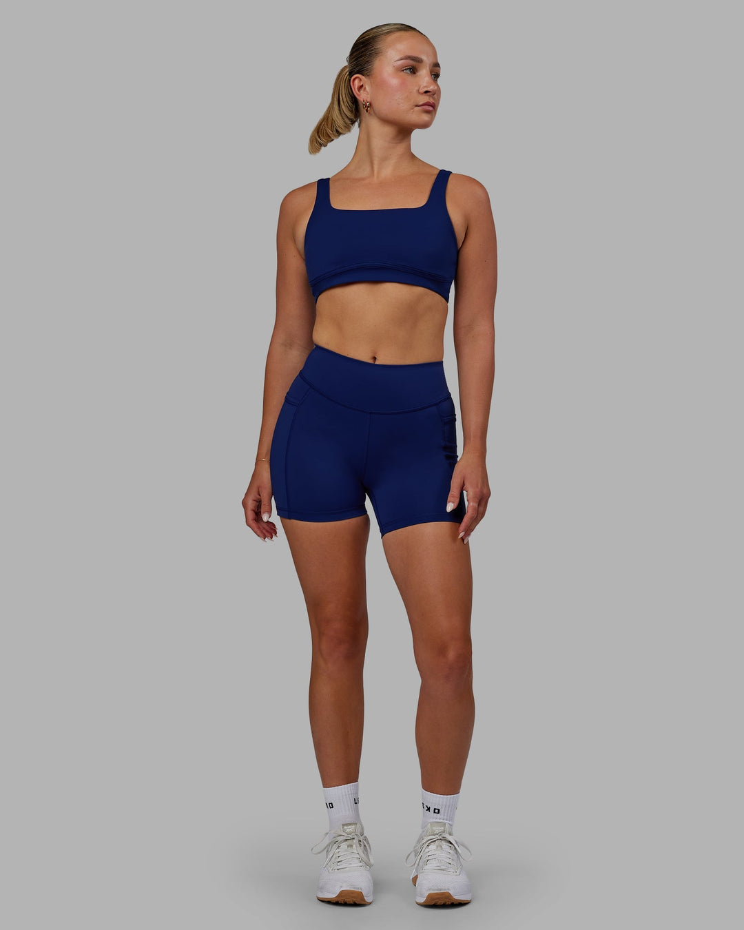 Woman wearing Elite X-Length Shorts - Midnight Blue