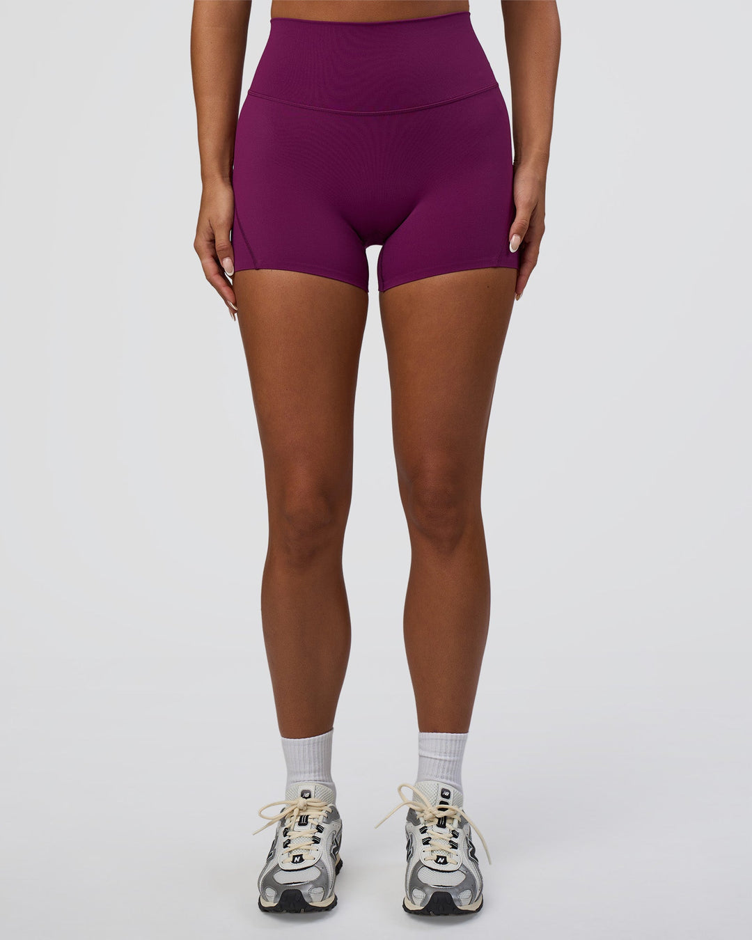 Woman wearing Elixir Defined High-Rise 4&quot; Short - Plum Caspia | Model:Bianca | Size:S