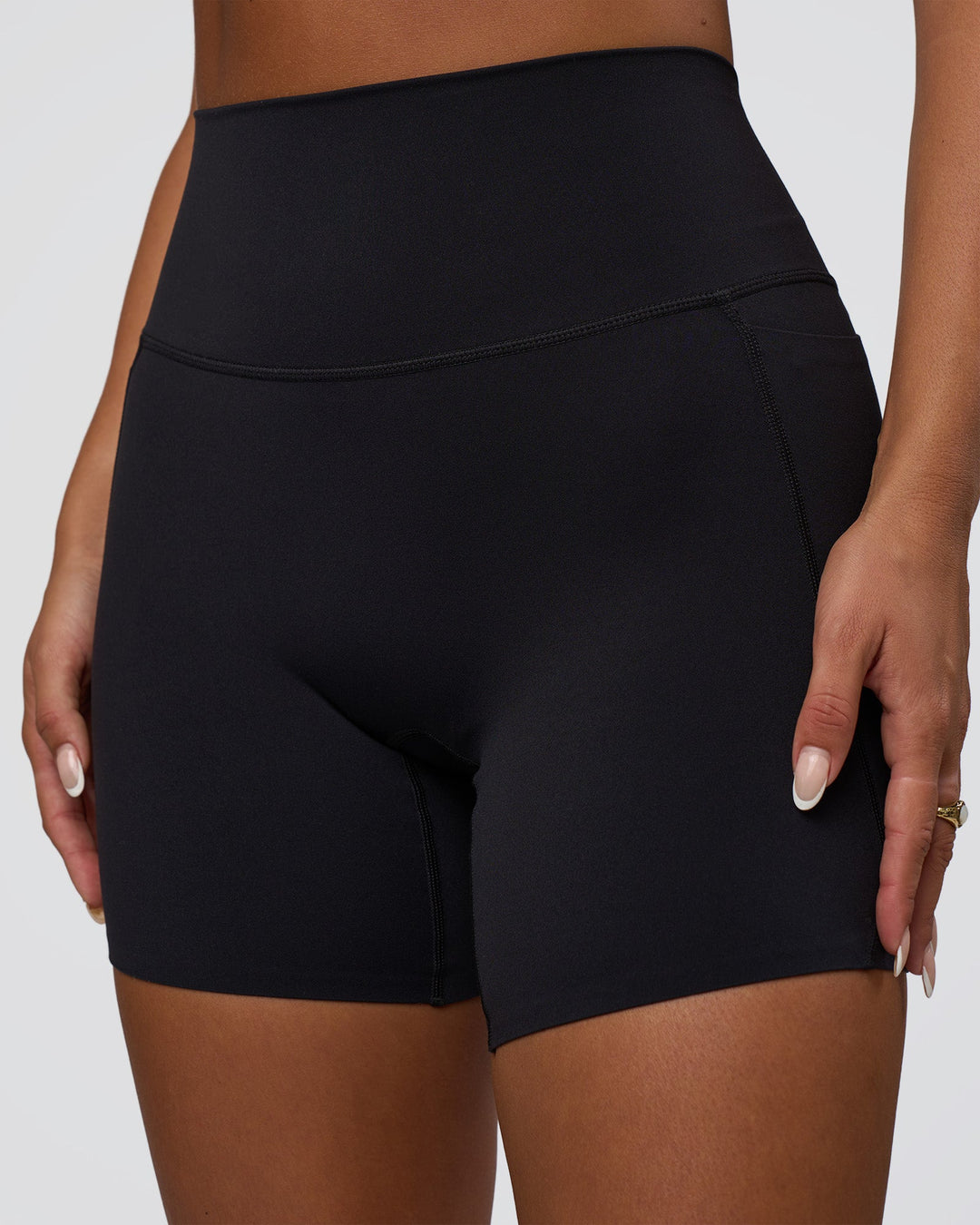 Woman wearing Elixir Defined High-Rise 6&quot; Short Pockets - Black | Model:Bianca | Size:S