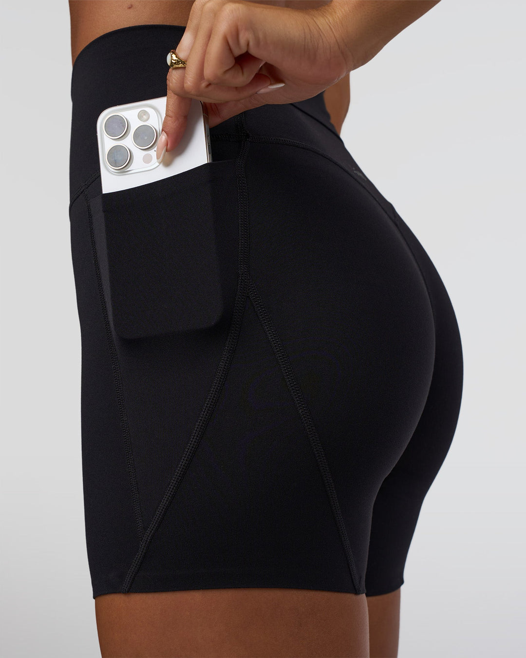 Woman wearing Elixir Defined High-Rise 6&quot; Short Pockets - Black | Model:Bianca | Size:S