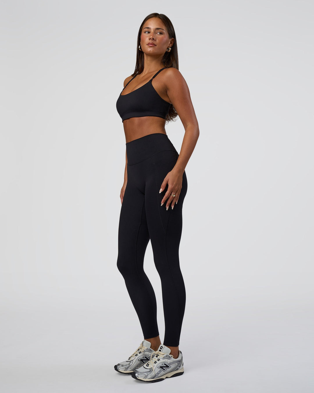 Woman wearing Elixir Defined High-Rise Full Length Legging Pockets - Black | Model:Bianca | Size:S