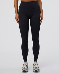 Woman wearing Elixir Defined High-Rise Full Length Legging Pockets - Black | Model:Bianca | Size:S