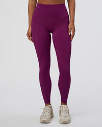 Woman wearing Elixir Defined High-Rise Full Length Legging Pockets - Plum Caspia | Model:Bianca | Size:S