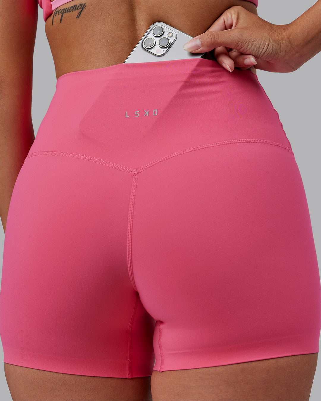 Woman wearing Elixir High-Rise 4&quot; Short - Hot Pink | Model:Rhiley | Size:S