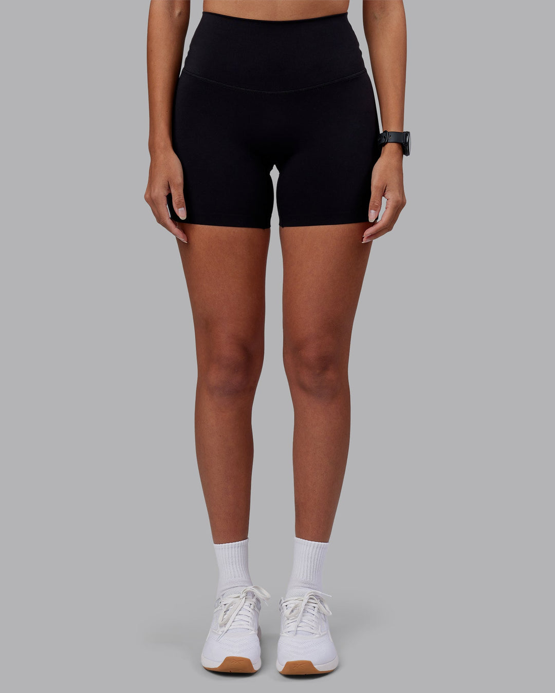 Woman wearing Elixir High-Rise 6&quot; Short - Black | Model:Rhiley | Size:S