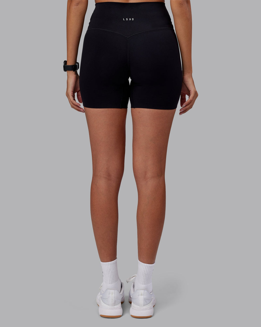 Woman wearing Elixir High-Rise 6&quot; Short - Black | Model:Rhiley | Size:S