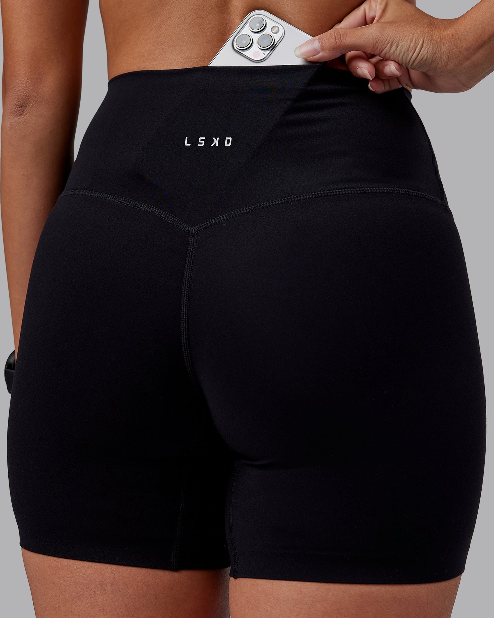 Woman wearing Elixir High-Rise 6" Short - Black | Model:Rhiley | Size:S
