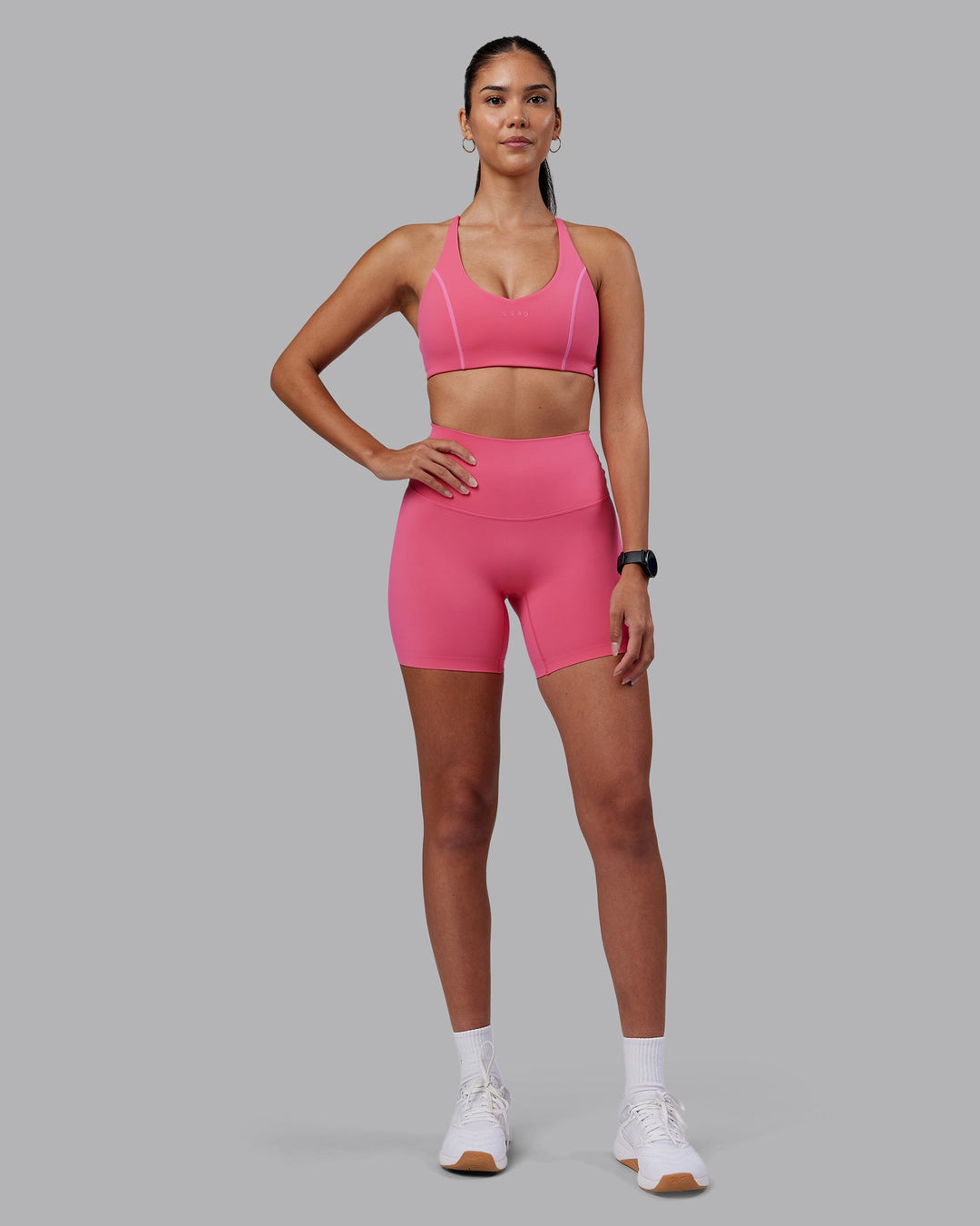 Woman wearing Elixir High-Rise 6&quot; Short - Hot Pink | Model:Rhiley | Size:S