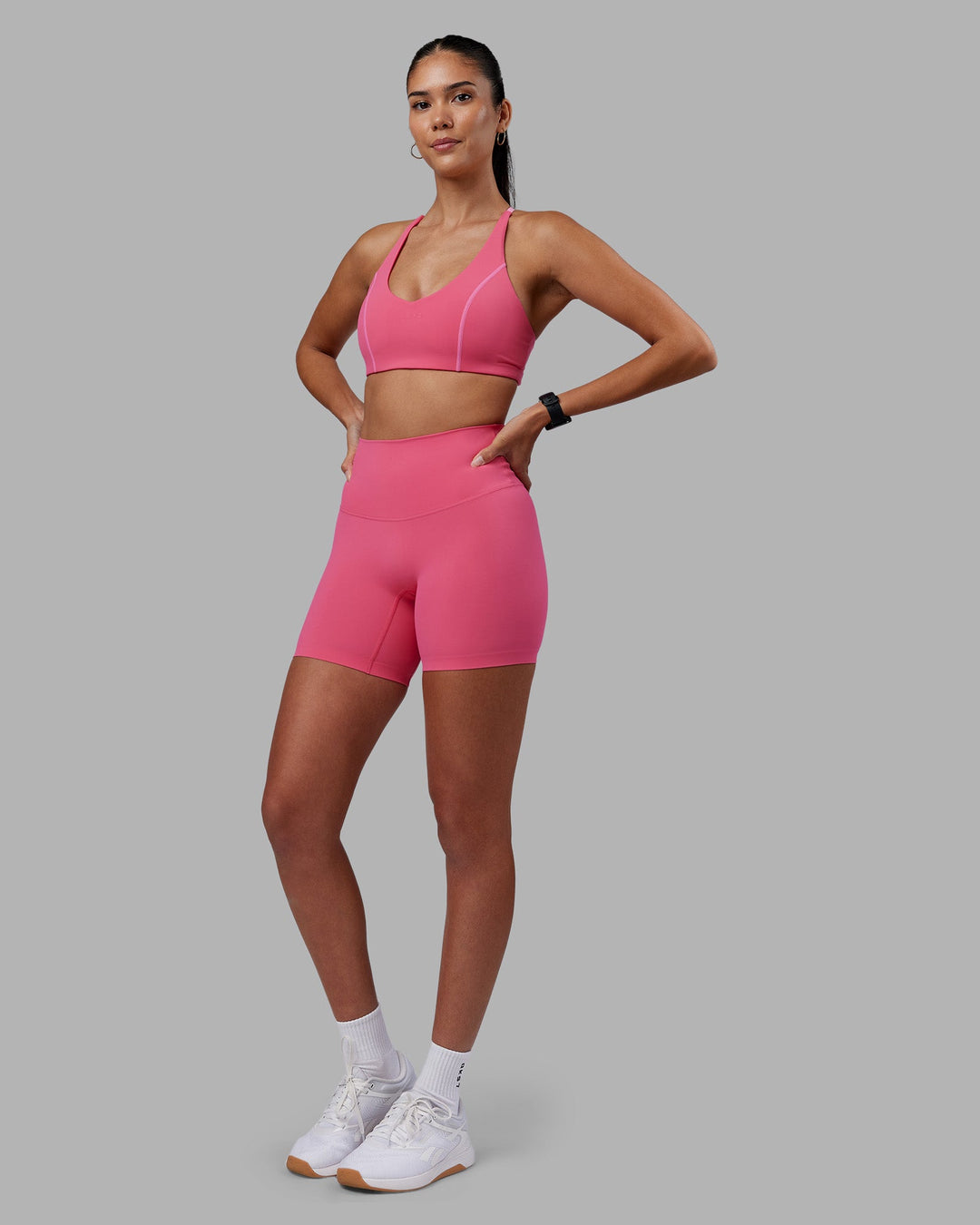 Woman wearing Elixir High-Rise 6&quot; Short - Hot Pink | Model:Rhiley | Size:S