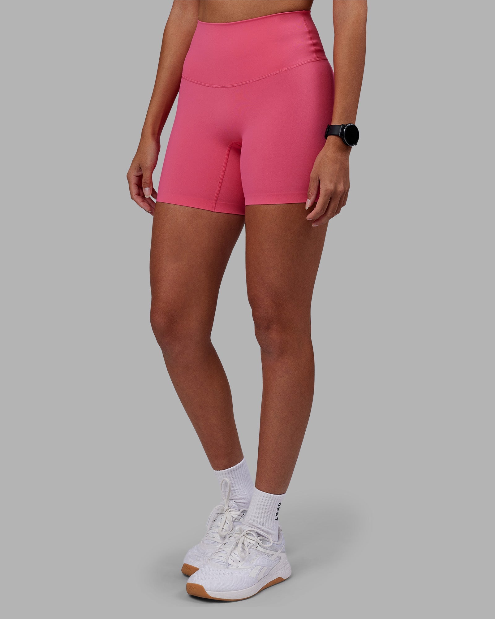 Woman wearing Elixir High-Rise 6" Short - Hot Pink | Model:Rhiley | Size:S