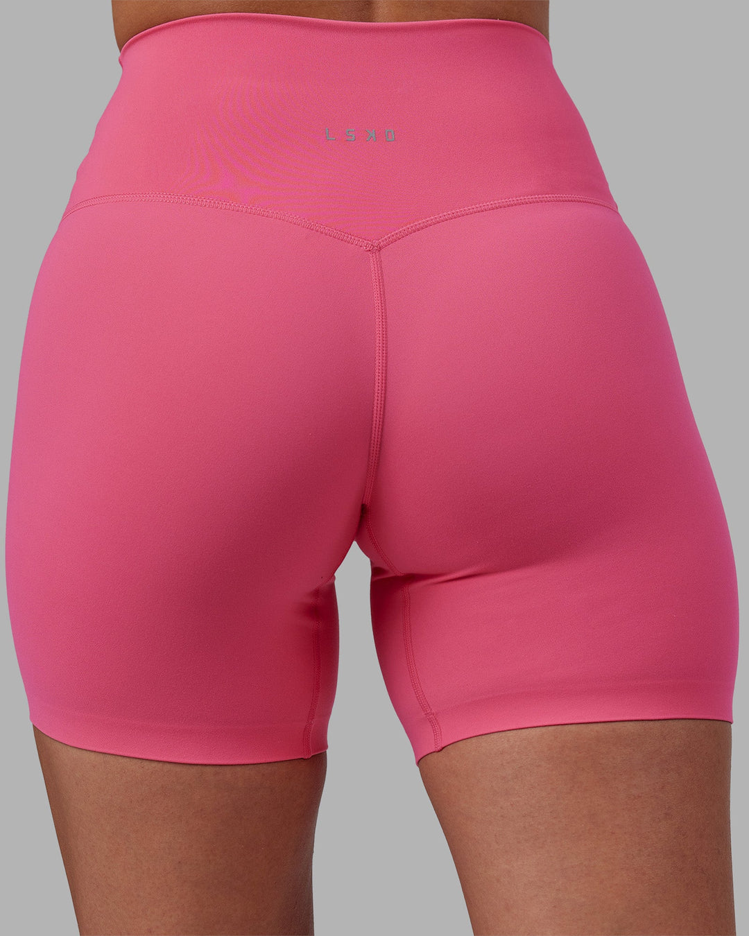 Woman wearing Elixir High-Rise 6&quot; Short - Hot Pink | Model:Rhiley | Size:S