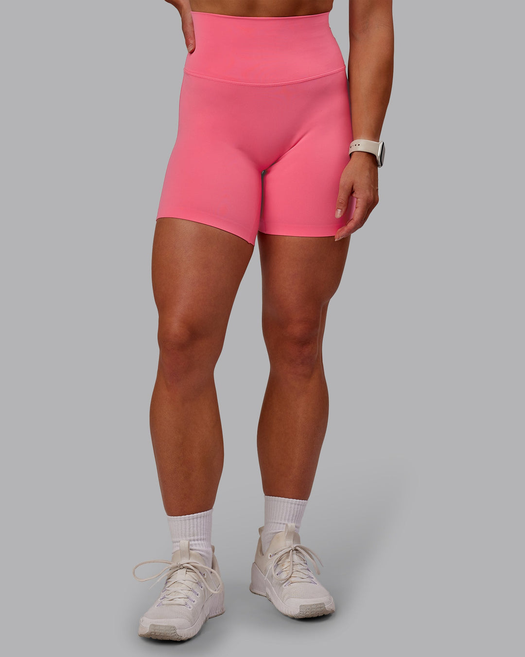 Woman wearing Elixir Mid Short Tight in Pink Lemonade | Size:S