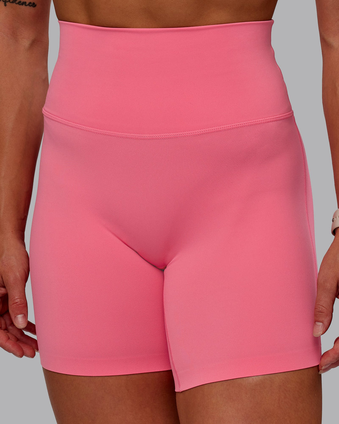 Woman wearing Elixir Mid Short Tight in Pink Lemonade | Size:S