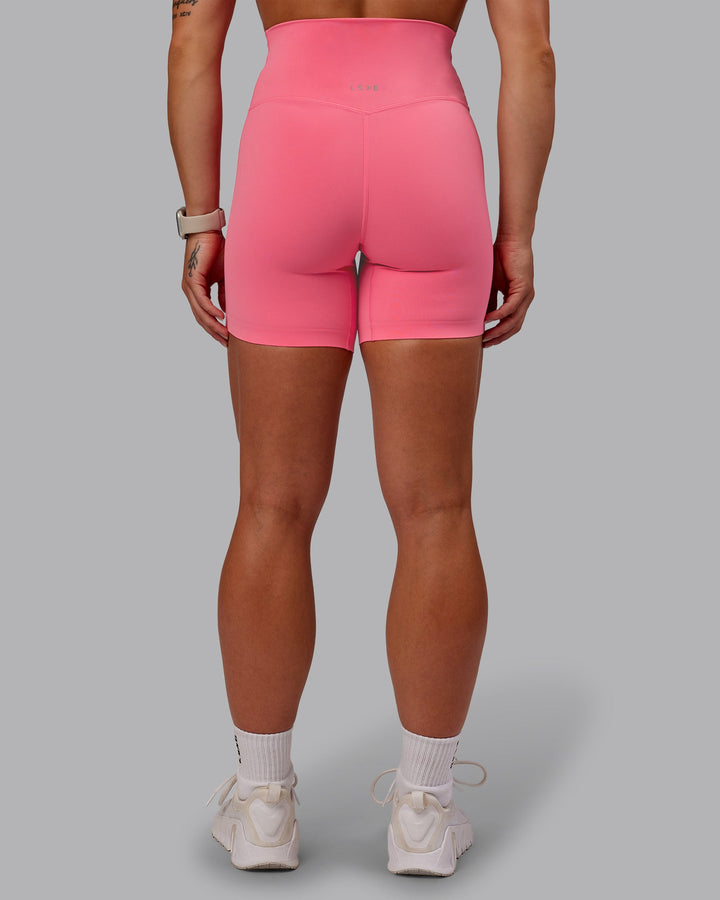 Woman wearing Elixir Mid Short Tight in Pink Lemonade | Size:S
