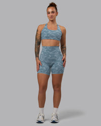 Woman wearing Elixir Ultra High-Rise 6" Short Pockets - Tranquil-Elemental Blue