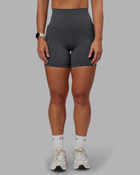 Woman wearing Elixir Ultra High-Rise 6" Short Pockets in Dark Storm | Size:S