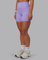 Woman wearing Elixir Ultra High-Rise 6" Short Pockets in Violet Ray | Size:S