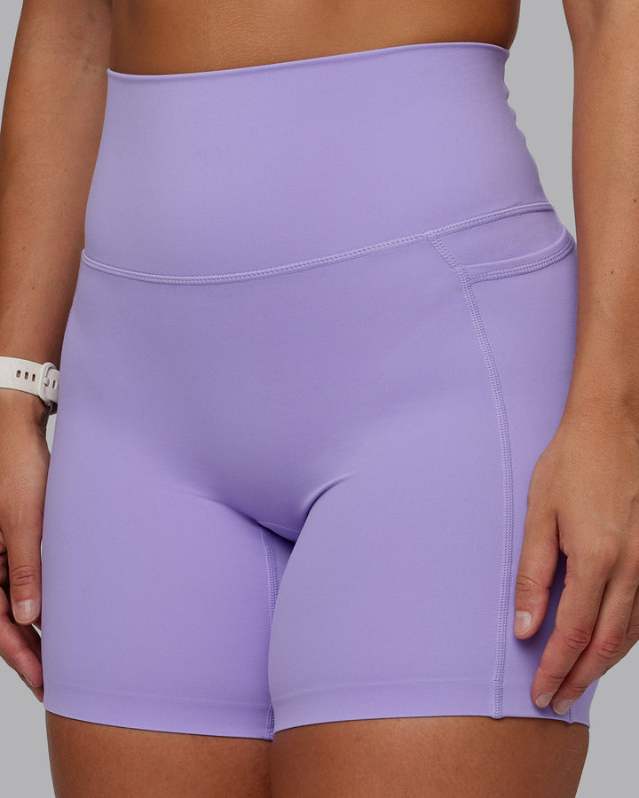 Woman wearing Elixir Mid Short Tight With Pockets in Violet Ray | Size:S
