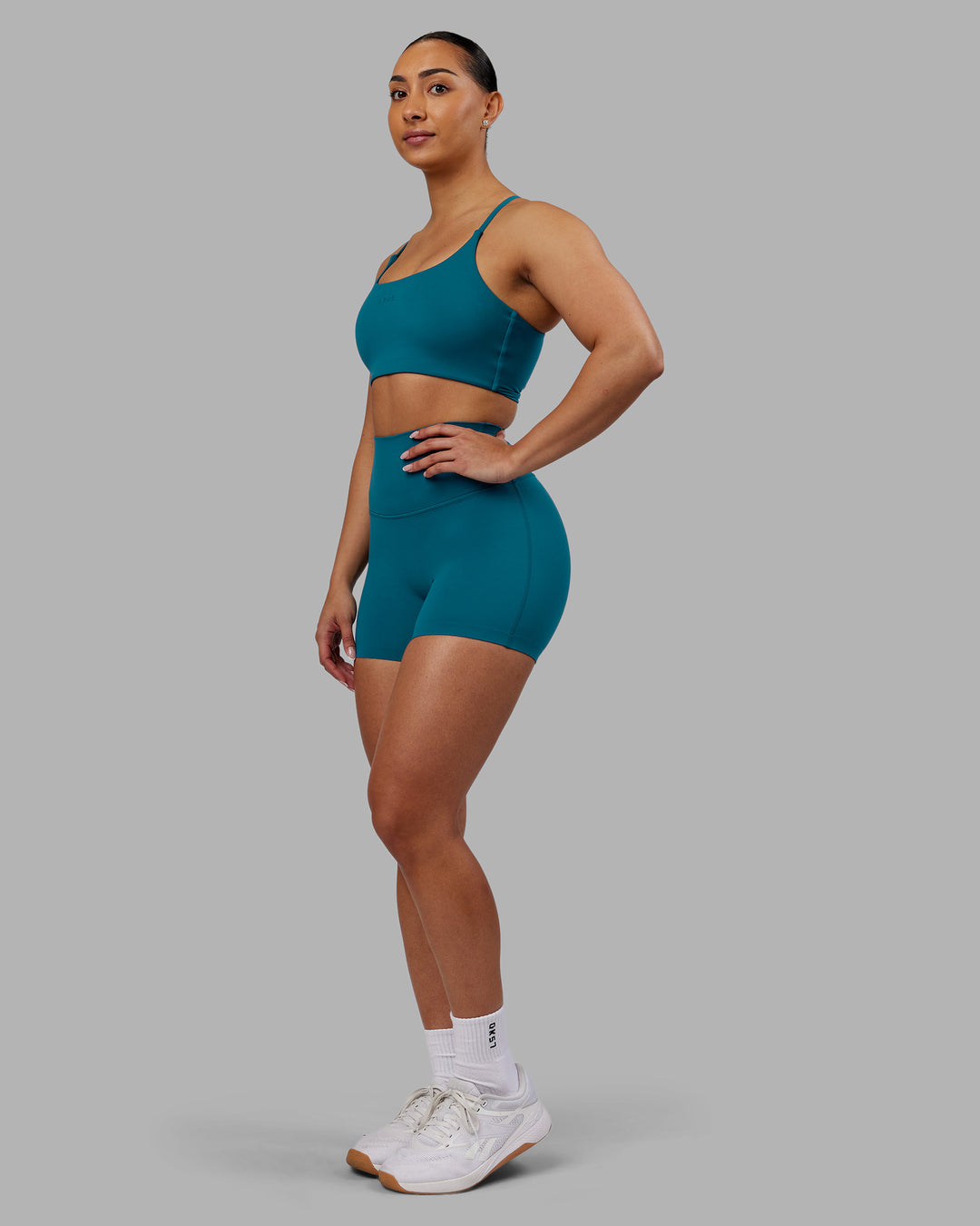 Woman wearing Elixir Ultra High-Rise 4&quot; Short - Blue Coral | Model:Ayla | Size:S