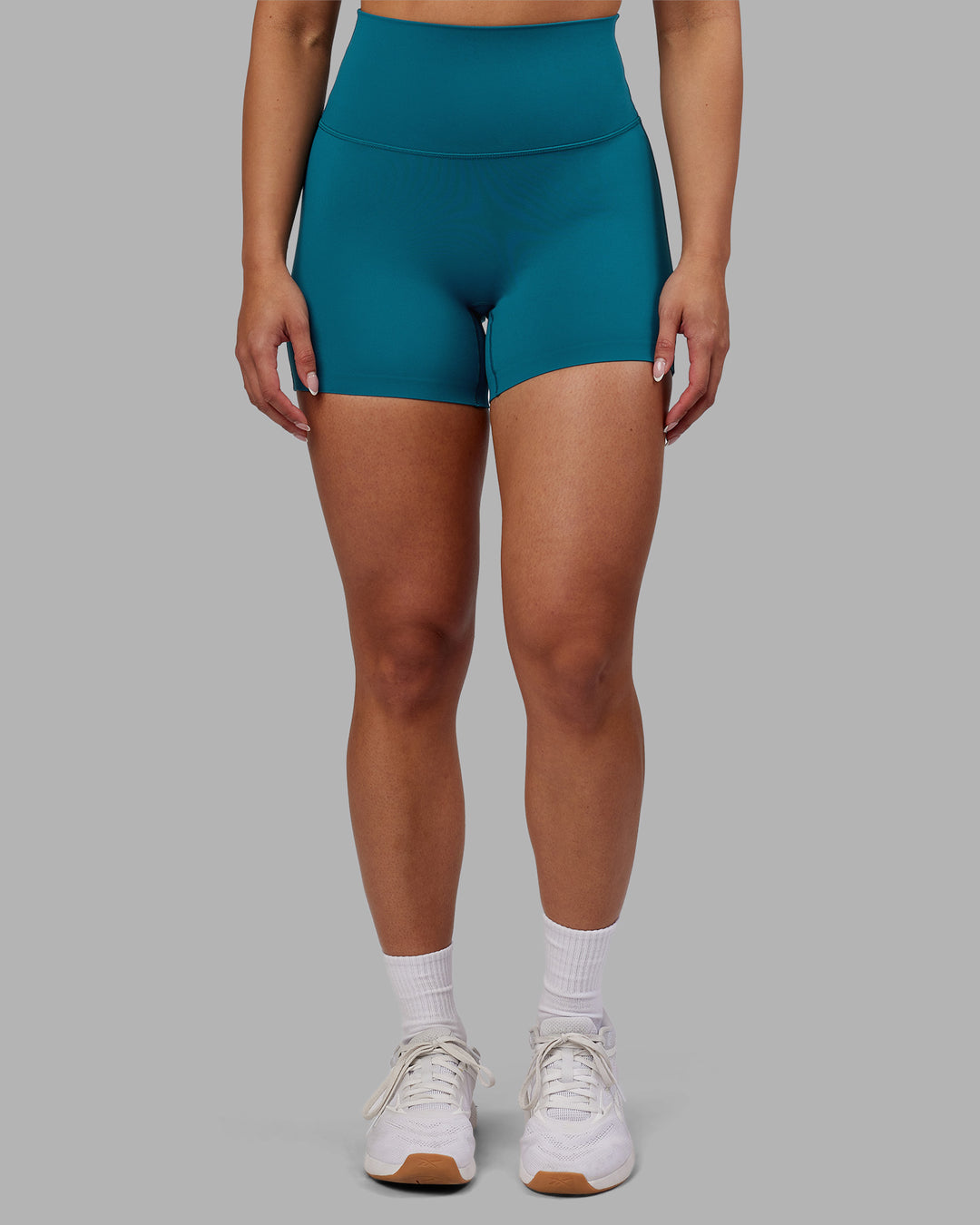 Woman wearing Elixir Ultra High-Rise 4&quot; Short - Blue Coral | Model:Ayla | Size:S