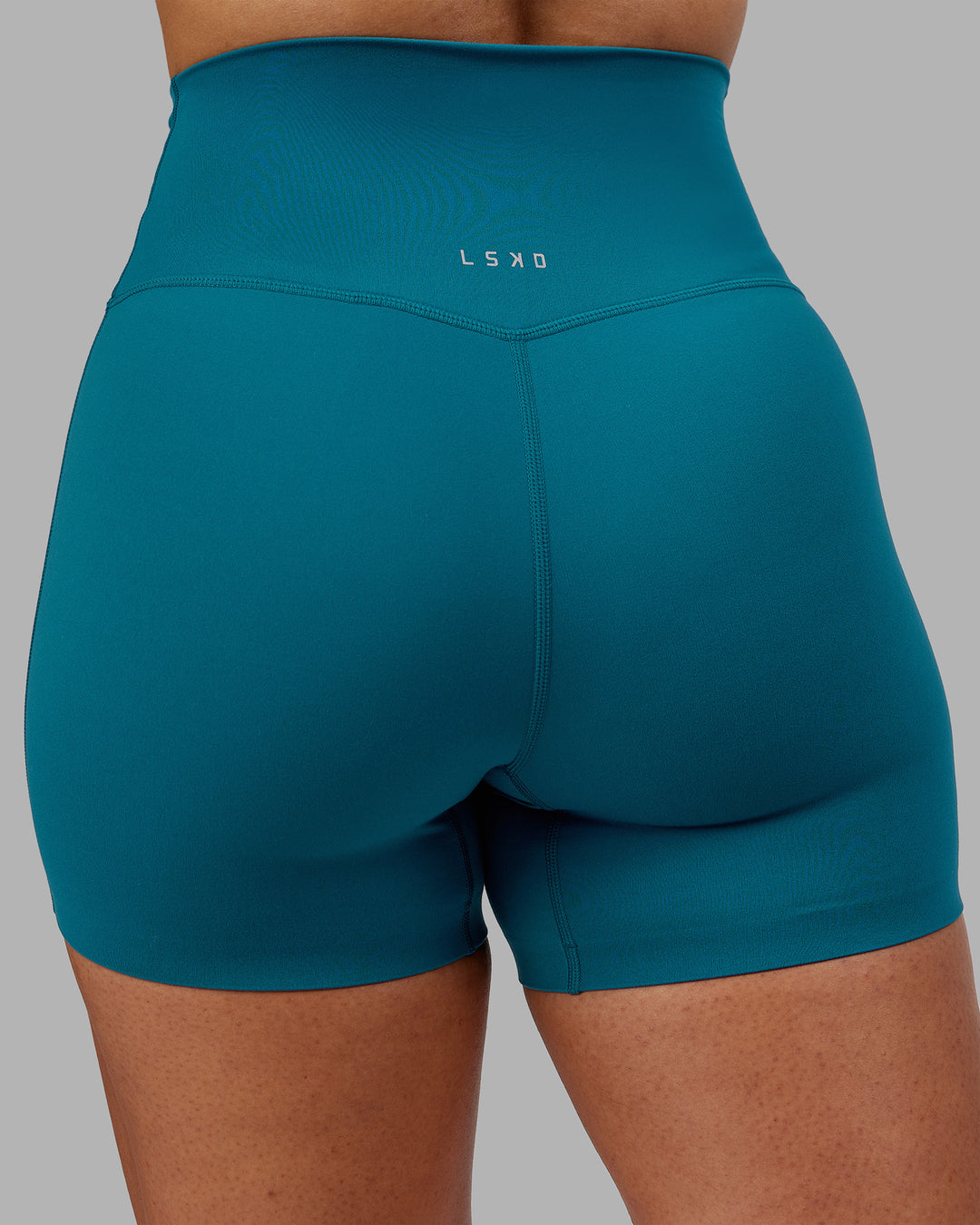 Woman wearing Elixir Ultra High-Rise 4&quot; Short - Blue Coral | Model:Ayla | Size:S