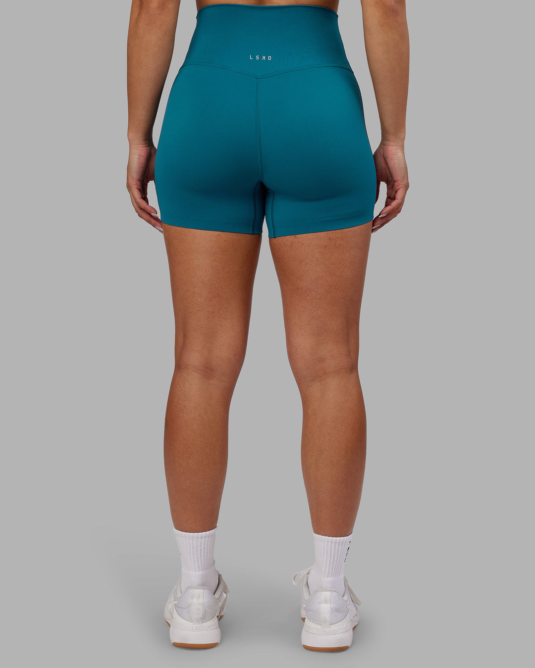 Woman wearing Elixir Ultra High-Rise 4&quot; Short - Blue Coral | Model:Ayla | Size:S