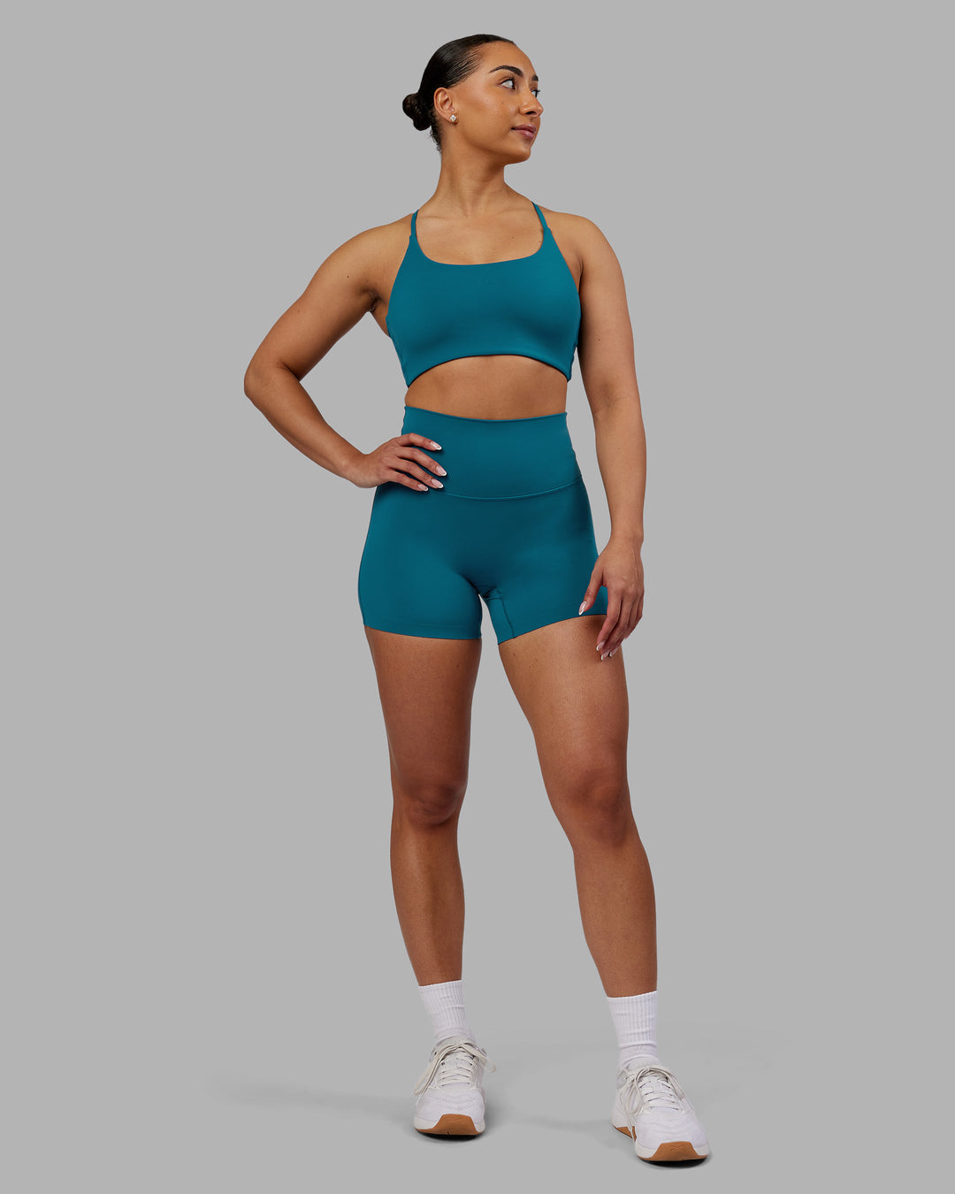 Woman wearing Elixir Ultra High-Rise 4&quot; Short - Blue Coral | Model:Ayla | Size:S