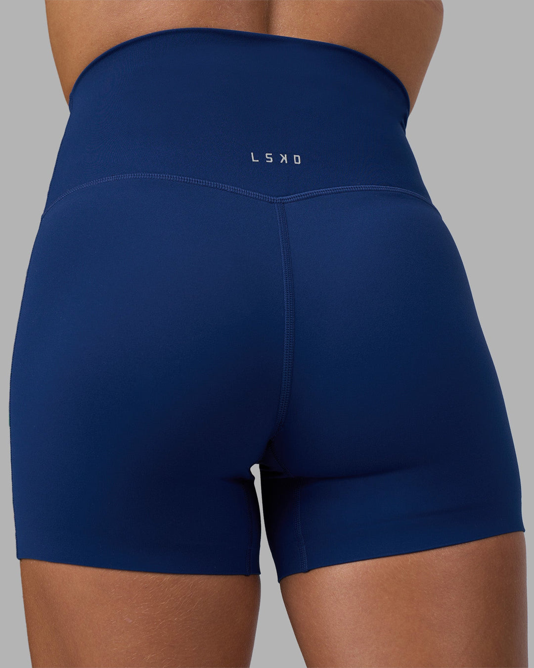 Woman wearing Elixir Ultra High-Rise 4&quot; Short - Midnight Blue | Model:Katie | Size:S