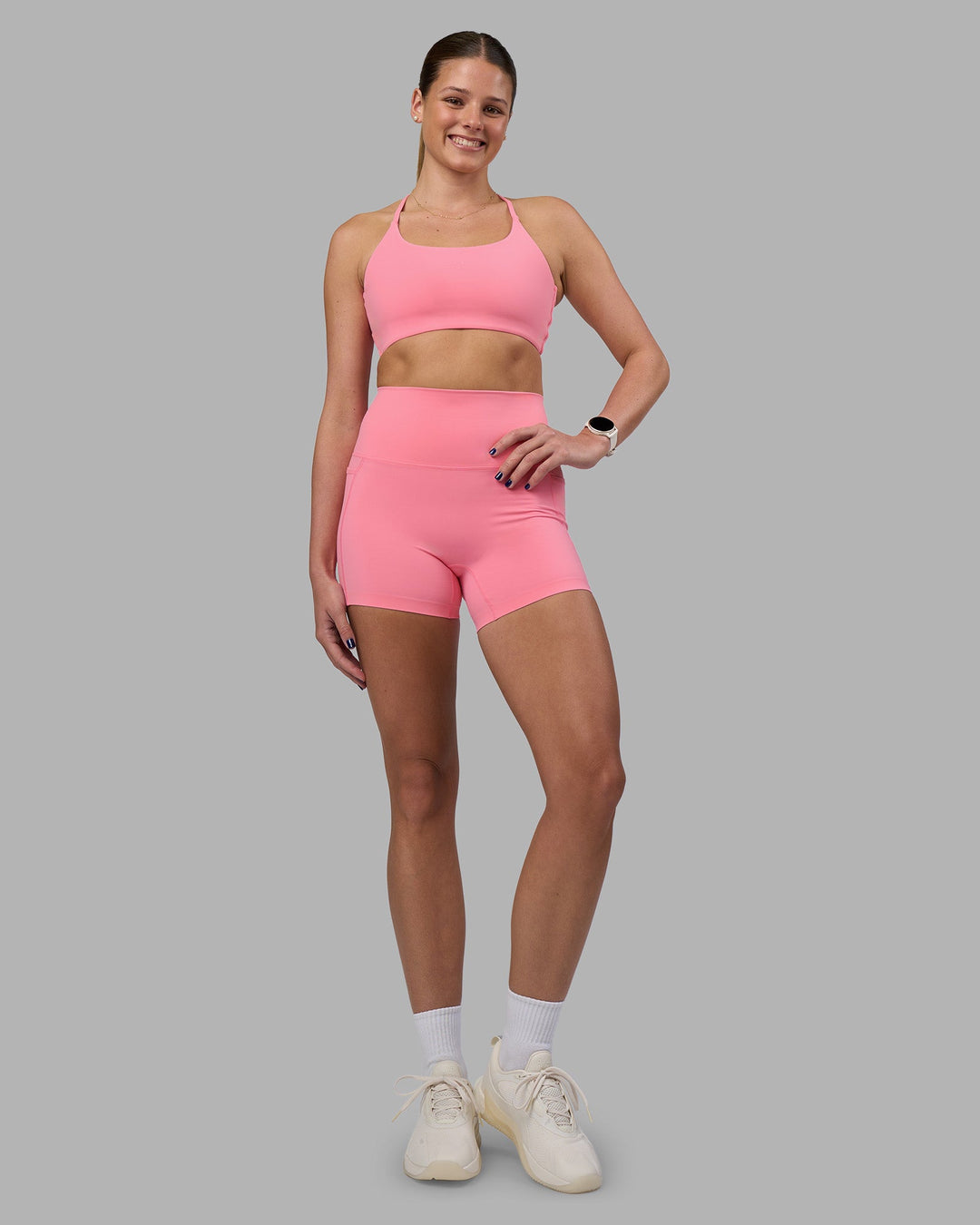 Woman wearing Elixir Ultra High-Rise 4&quot; Short Pockets - Candy Pink | Model:Phoebe | Size:S