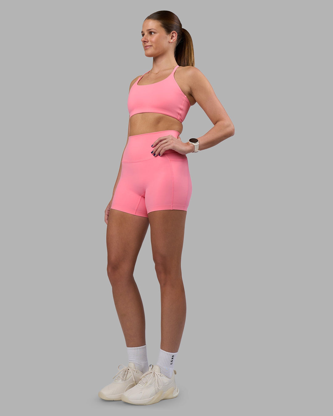 Woman wearing Elixir Ultra High-Rise 4&quot; Short Pockets - Candy Pink | Model:Phoebe | Size:S