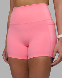 Woman wearing Elixir Ultra High-Rise 4" Short Pockets - Candy Pink | Model:Phoebe | Size:S