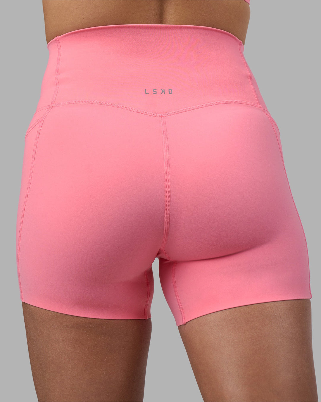 Woman wearing Elixir Ultra High-Rise 4&quot; Short Pockets - Candy Pink | Model:Phoebe | Size:S