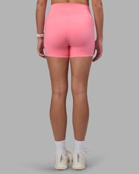 Woman wearing Elixir Ultra High-Rise 4" Short Pockets - Candy Pink | Model:Phoebe | Size:S