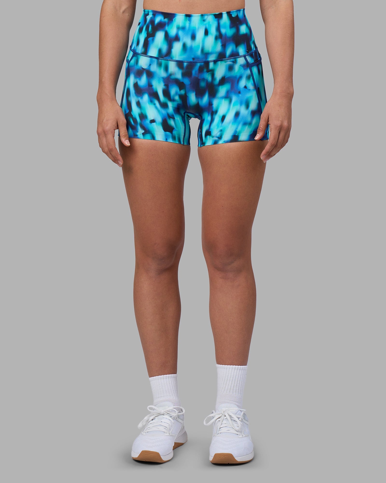 Woman wearing Elixir Ultra High-Rise 4" Short Pockets - Luminous | Model:Sophie | Size:S