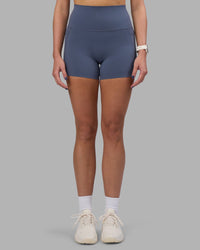 Woman wearing Elixir Ultra High-Rise 4" Short Pockets - Night Shadow | Model:Phoebe | Size:S