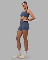 Woman wearing Elixir Ultra High-Rise 4" Short Pockets - Night Shadow | Model:Phoebe | Size:S