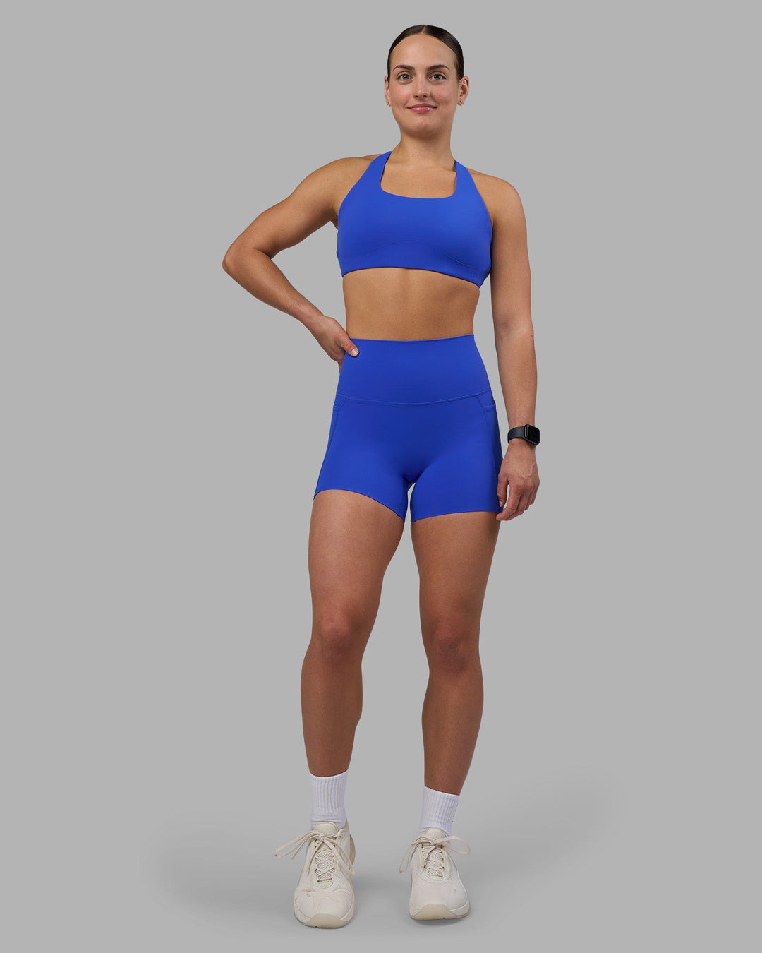 Woman wearing Elixir Ultra High-Rise 4&quot; Short Pockets - Power Cobalt | Model:Keisha | Size:S