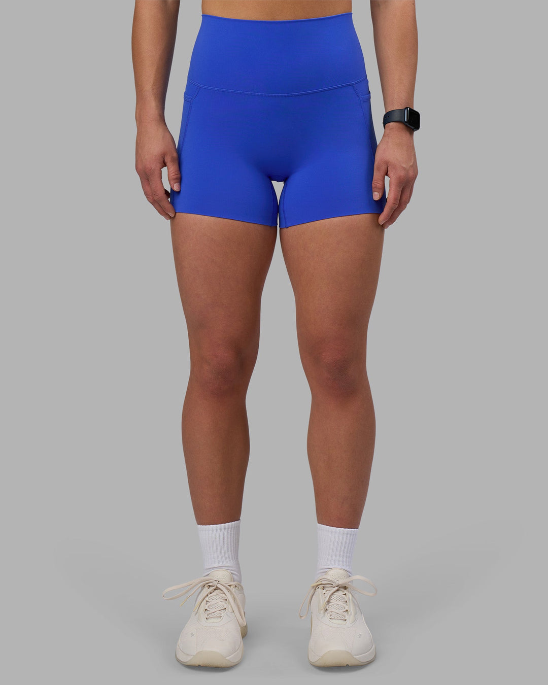 Woman wearing Elixir Ultra High-Rise 4&quot; Short Pockets - Power Cobalt | Model:Keisha | Size:S