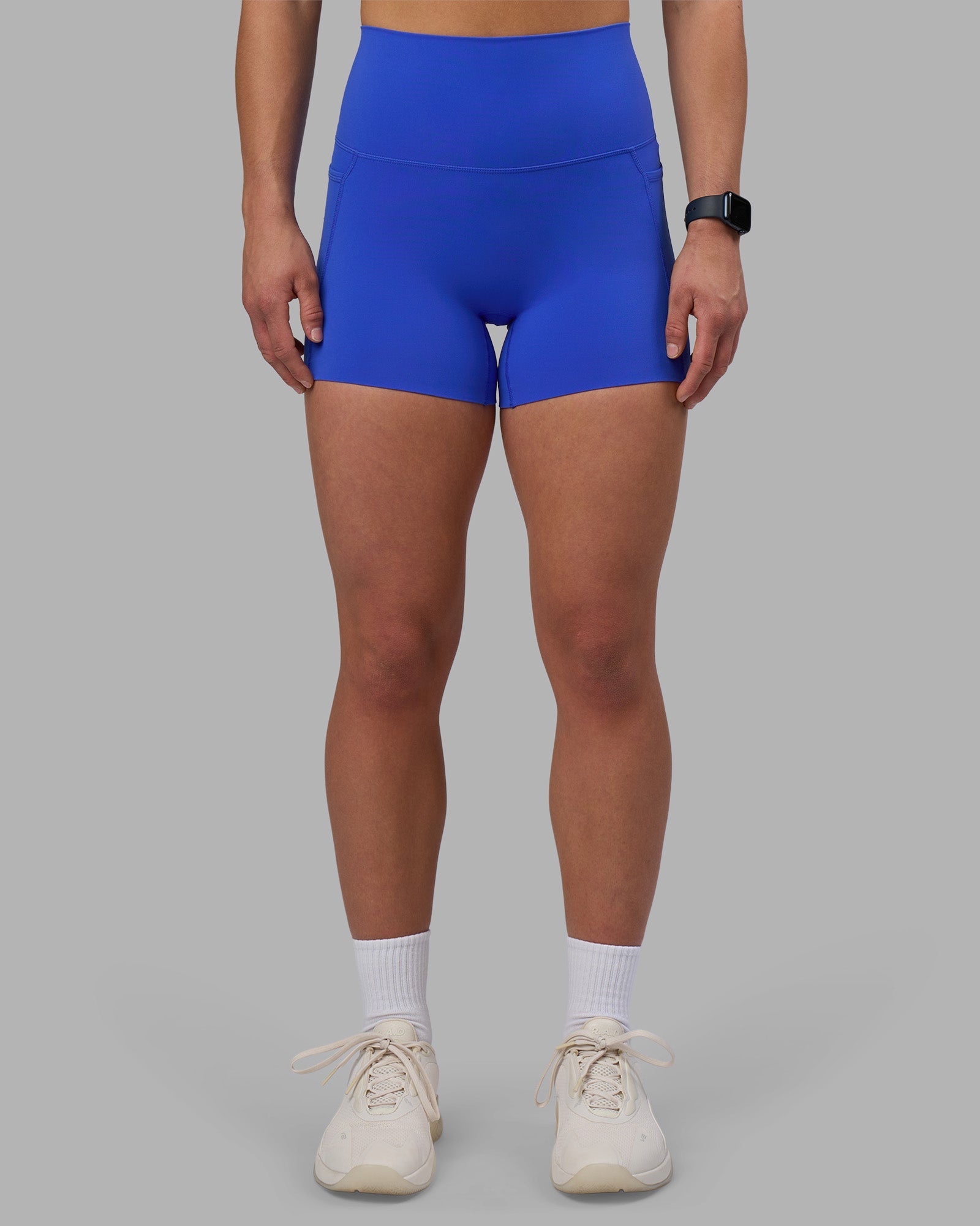 Woman wearing Elixir Ultra High-Rise 4" Short Pockets - Power Cobalt | Model:Keisha | Size:S