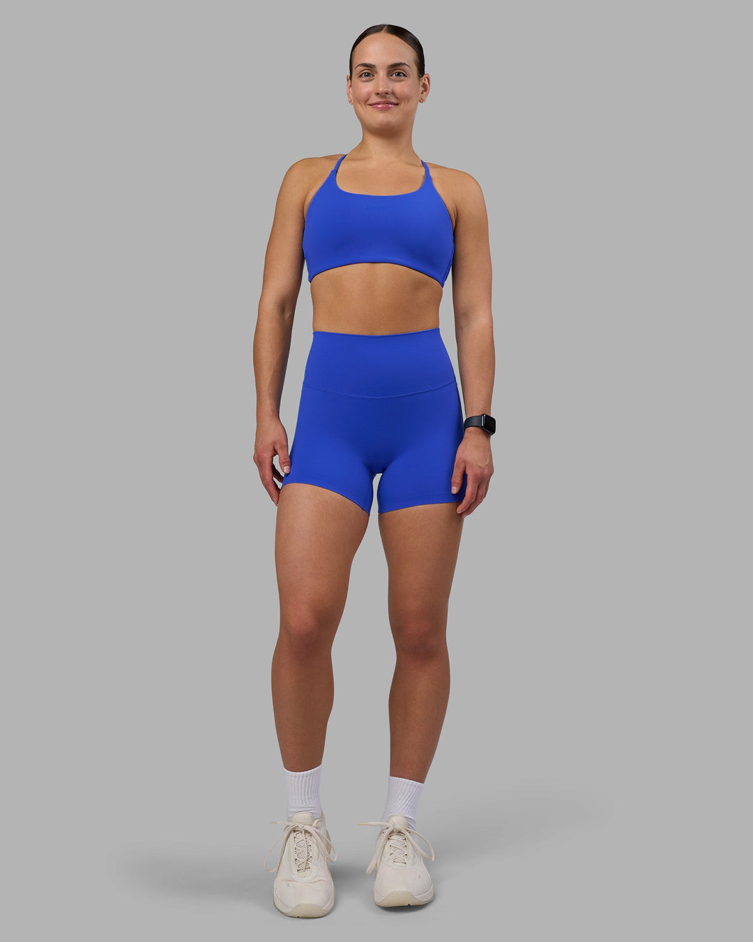 Woman wearing Elixir Ultra High-Rise 4&quot; Short - Power Cobalt | Model:Keisha | Size:S
