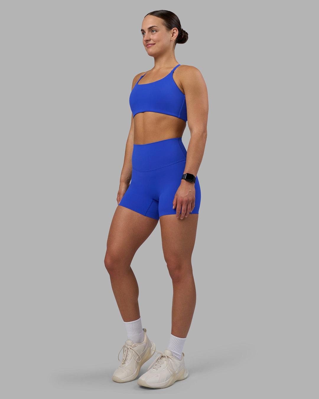 Woman wearing Elixir Ultra High-Rise 4&quot; Short - Power Cobalt | Model:Keisha | Size:S