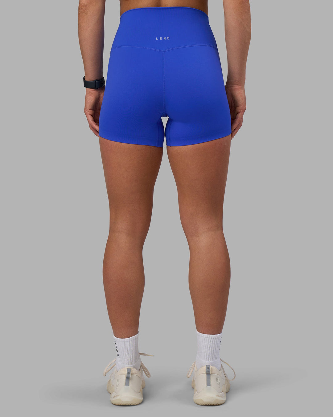 Woman wearing Elixir Ultra High-Rise 4&quot; Short - Power Cobalt | Model:Keisha | Size:S