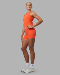 Woman wearing Elixir Ultra High-Rise 4" Short - Ultra Orange | Model:Katie | Size:S
