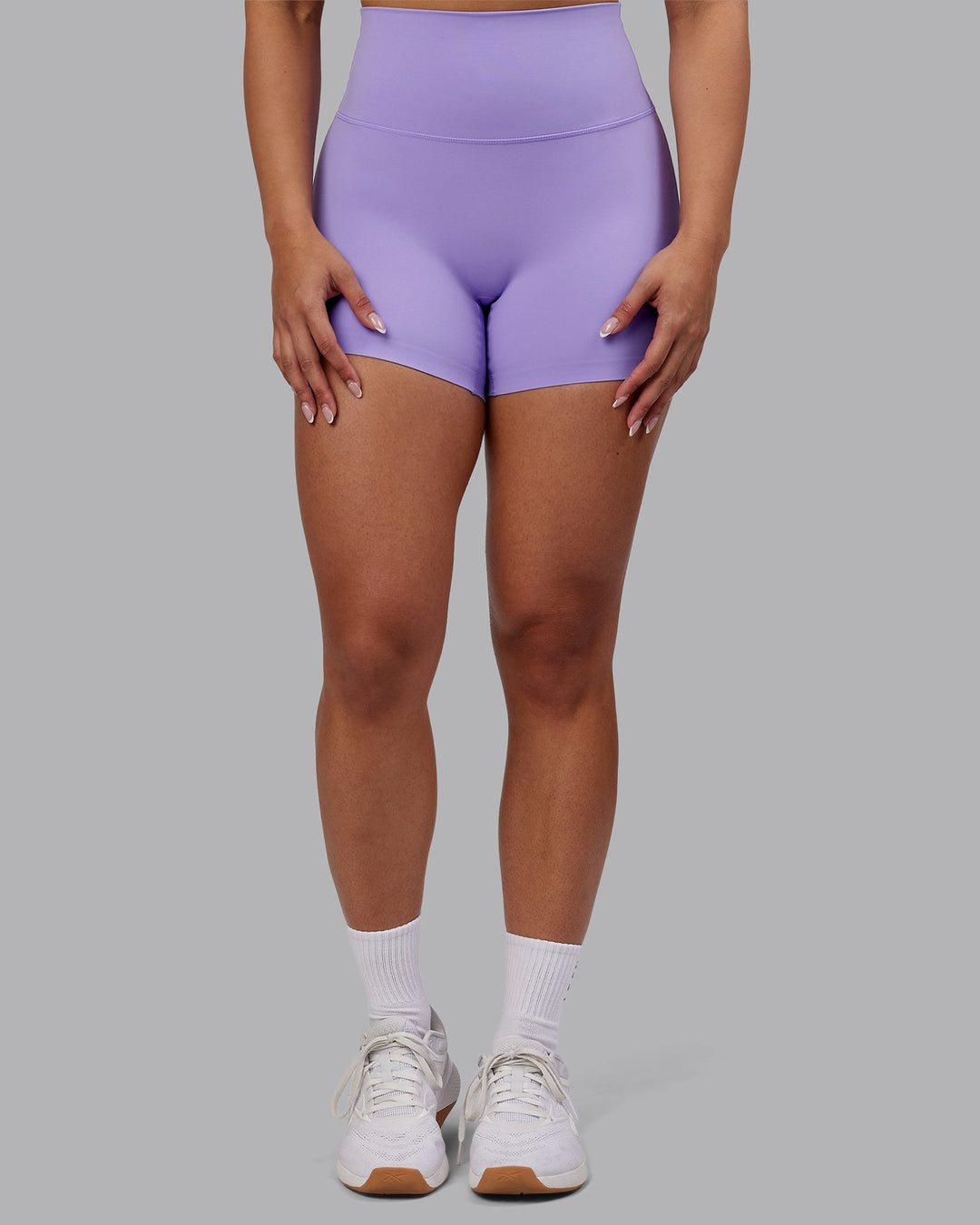 Woman wearing Elixir Ultra High-Rise 4&quot; Short - Violet Ray | Model:Ayla | Size:S