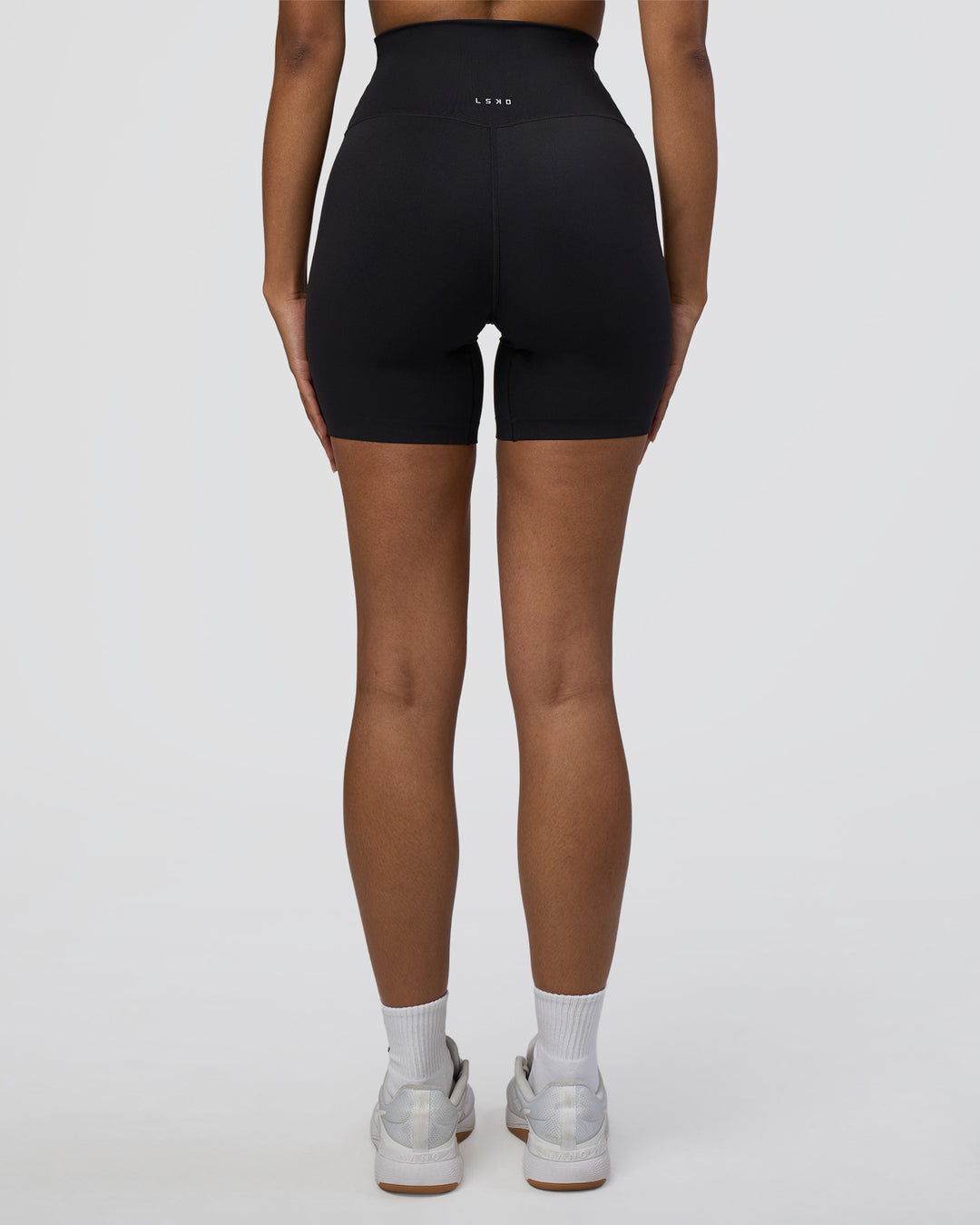 Woman wearing Elixir Ultra High-Rise 6&quot; Short - Black | Model:Jordan | Size:S